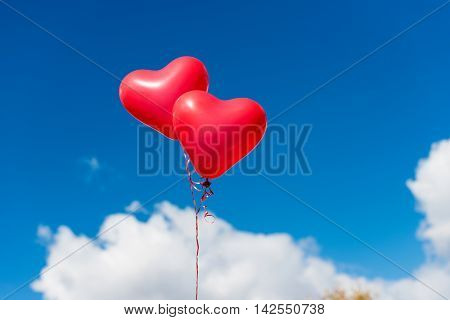 Valentine heart balloon against blue sky background