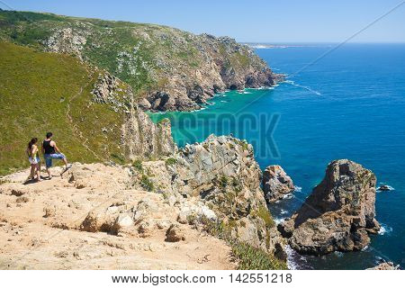 SINTRA PORTUGAL - JULY 15 2016: Cabo da Roca is a cape located close to Lisbon which forms the westernmost extent of mainland Portugal and continental Europe.