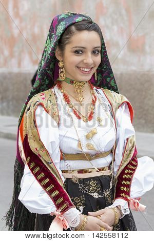 CAGLIARI, ITALY - May 1, 2014: 358 ^ Religious Procession of Sant'Efisio - Sardinia - portrait of a beautiful girl in traditional Sardinian costume