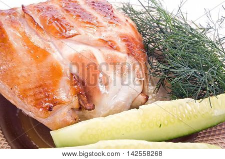 Portion of the fried hen and vegetable garnish