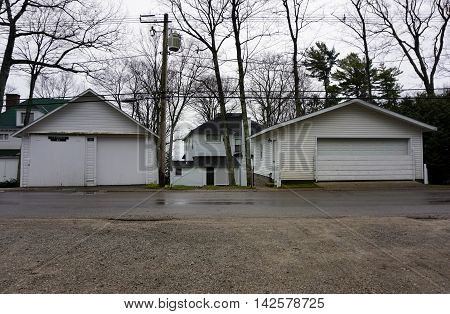 WEQUETONSING, MICHIGAN / UNITED STATES - DECEMBER 22, 2015: The garages of homes on Beach Road in Wequetonsing, Michigan.