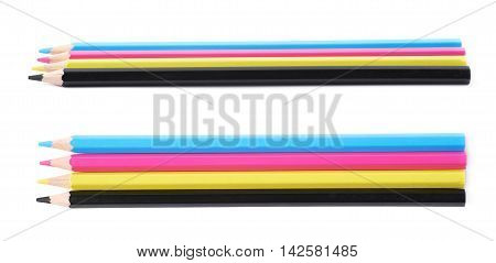 Four cmyk colored drawing pencils composition isolated over the white background