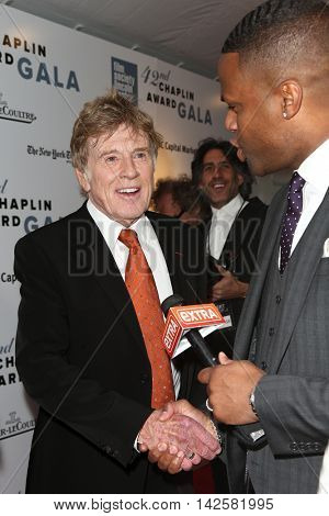 NEW YORK-APR 27: Honoree Robert Redford (L) speaks to TV personality A. J. Calloway at the 42nd Chaplin Award Gala at Alice Tully Hall, Lincoln Center on April 27, 2015 in New York City.