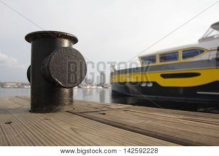 Yacht is at anchor and wooden jetty. Transport