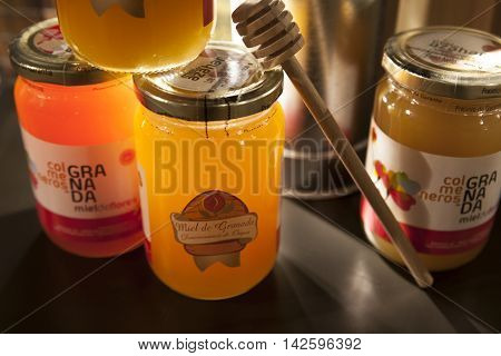 Granada Spain - August 5 2016: Stand with traditional wares of honey typical product from Granada Alpujarras Region Spain