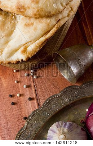 Traditional uzbek flatbread and a set of spices
