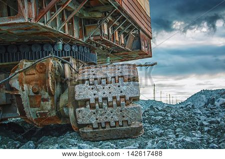 Excavator loads the factory gabbro, Russia, Ural