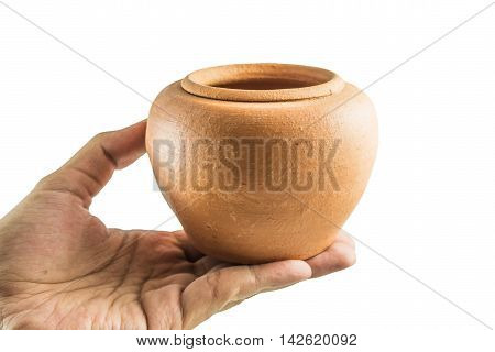 Men's hand holding Earthenware Jur isolate on a white background