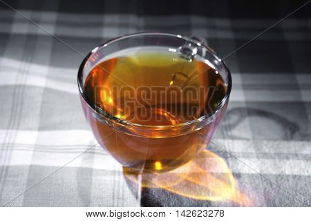cream cheese schnitt layer cake with tea and red fresh sweet grapes on wood background