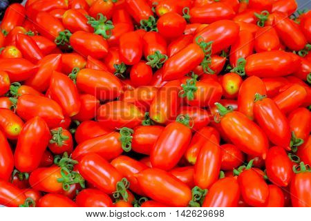 cherry tomatoes: A cherry tomato is a rounded small fruited tomato thought to be an intermediate genetic admixture between wild currant-type tomatoes and domesticated garden tomatoes