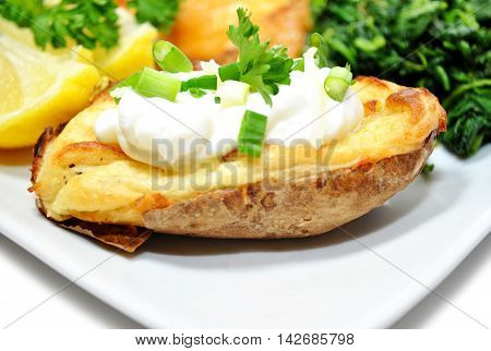 Served Baked Potato with Sour Cream and Scallions