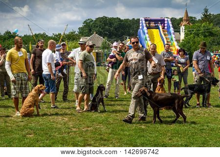 Perekhrest Ukraine - August 14. 2016: Participants prepare for the show of hunting dogs during the first festival of hunters.