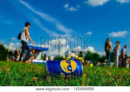 Perekhrest Ukraine - August 14. 2016: Visitors are near the cans to throw a drink on the grass during the first festival of hunters.