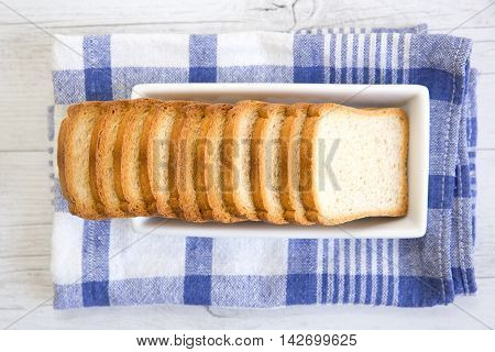 A Group Of Rusks On A White Platter