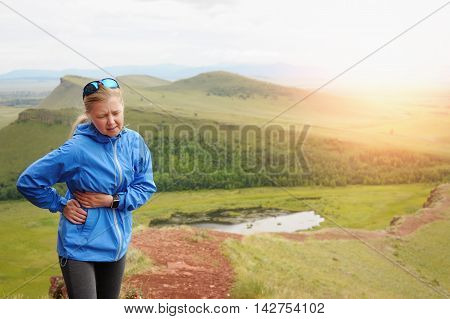 Side Stitch - Woman Runner Side Cramps. Running In The Mountains.