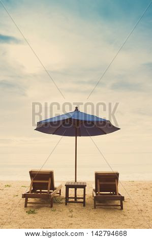 holiday beach with beach chair and beach unbrella process photo with vintage style