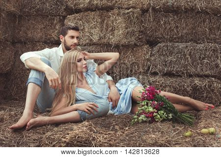 Man and a woman dreaming they are in the hayloft in the village.