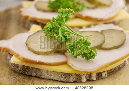 Sandwich With Meat And Chease On Cutting Board. Soft Focus