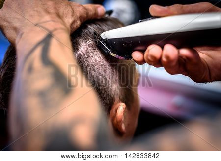 Close-up Of A Man Getting His Hair Shaved With Trimmer.