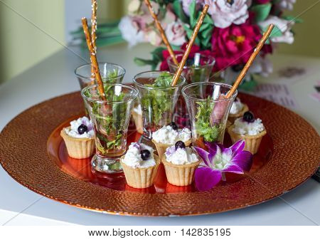 Puff pastry with cream cheese placed on a metall dish