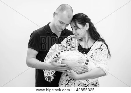 Happy Family Holding Their Newborn Baby In Her Arms.black And White Photography