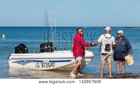 Men Returning From A Sea Fishing Competition