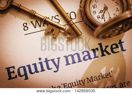 Vintage / retro color style : Two brass keys and a pocket watch on an equity market principal / fundamental document. A concept of investing in the equity market that need some basic knowledge.