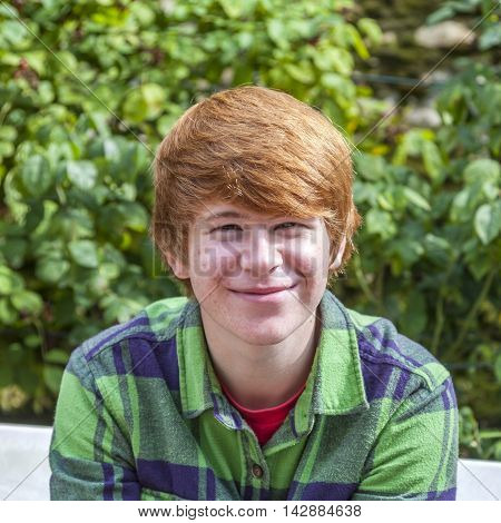 Boy Sitting On A Bench
