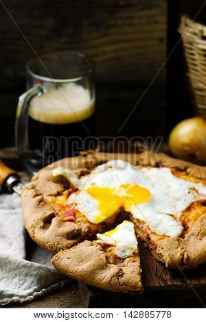 gallet with onion ham and egg . style rustic. selective focus