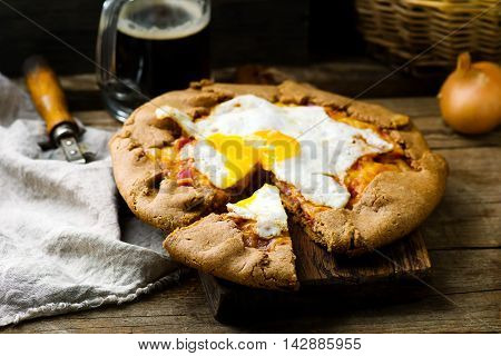 gallet with onion ham and egg . style rustic. selective focus