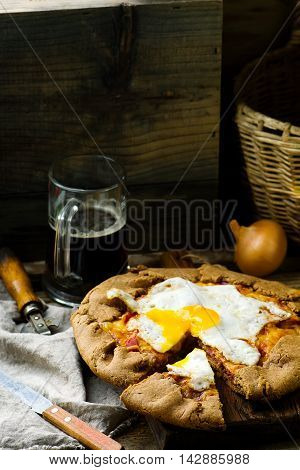 gallet with onion ham and egg . style rustic. selective focus
