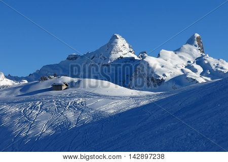 Winter scene in the Stoos ski area. Snow covered mountain peaks.