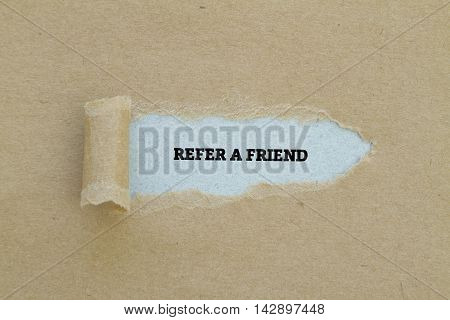 REFER A FRIEND word written under torn paper.