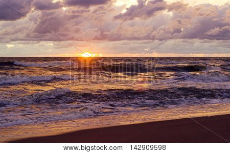 Sunset. Beautiful sunset at baltic sea. Gold sea sunset. Picture Sea sunset.