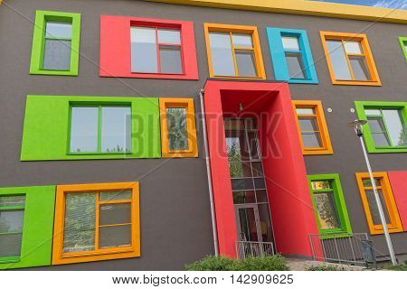 Multi-colored windows of the school in a contemporary style. Architecture