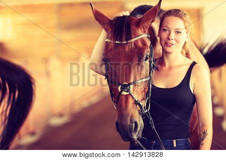 Young Woman Girl In Stable With Horse.