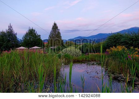 Fisching, Austria, August 3, 2016: A bio pond at sun set in Fisching, Austria.