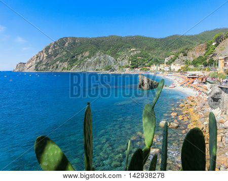 Monterosso, Italy - People on the coastline of Monterosso in Italy. Monterosso is one of five famous coastline villages in the Cinque Terre National Park.