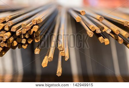 Steel rods or bars used to reinforce concrete. abstract macro with shallow depth of field.