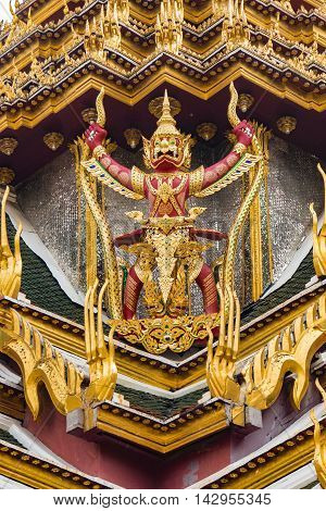 BANGKOK THAILAND - MARCH 28 2016: Detail of carvings on temple roof at Wat Phra Kaew the most sacred Buddhist temple and the most famous tourist attraction in Bangkok Thailand.