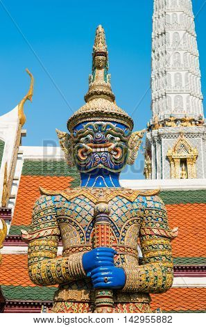 BANGKOK THAILAND - MARCH 9 2016: The blue giant demon guarding an exit to Grand Palace at Wat Phra Kaew in Bangkok Thailand.