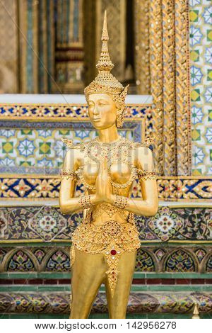 BANGKOK THAILAND - MARCH 17 2016: The statue of Kinnari a half-woman half-bird creature at Wat Phra Kaew in Bangkok Thailand.