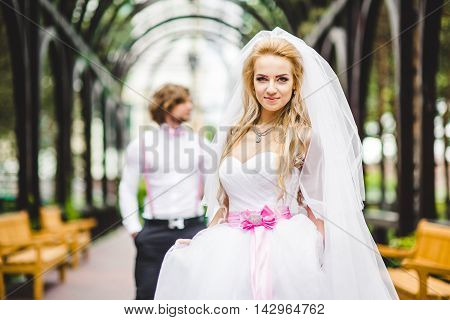 Elegant bride and groom posing together outdoors on a wedding day