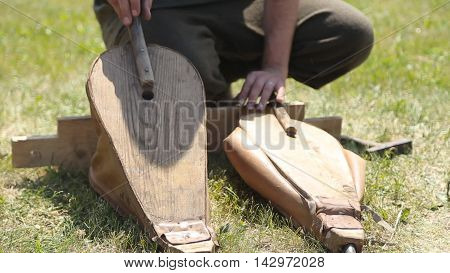 blacksmith forges inflates fur hand summer sun