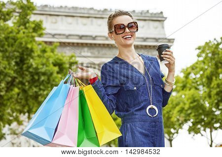 Smiling Young Trendy Woman With Shopping Bags In Paris, France