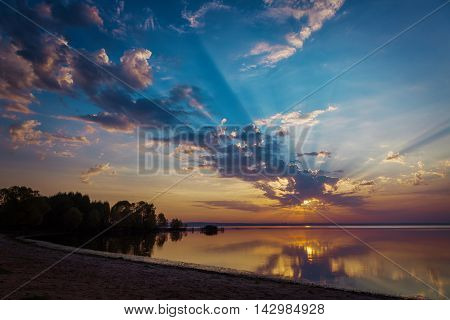 Sunset with reflectiion on the Lake Pleshcheyevo Russia