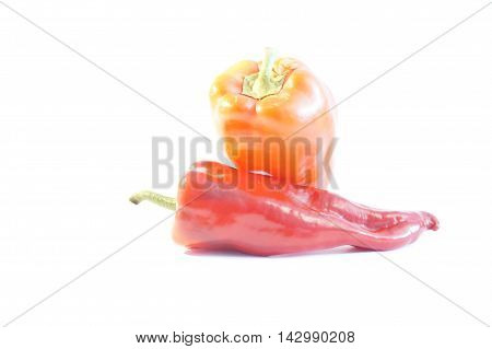 Red hot and sweet peppers isolated on white batskground