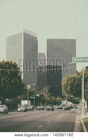 LOS ANGELES, UNITED STATES - DECEMBER 27: Traffic on a multi-lane road leading to the city center of Los Angeles with different skyscrapers on December 27, 2015 in Los Angeles.