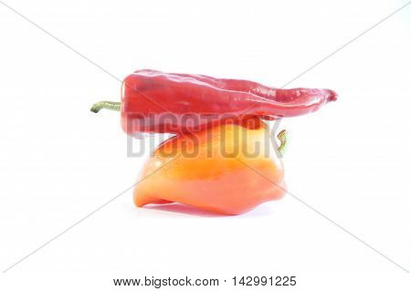 Red hot and sweet peppers isolated on white batskground