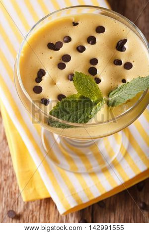 Zabaione Cream With Chocolate Drops Close Up In A Glass. Vertical Top View